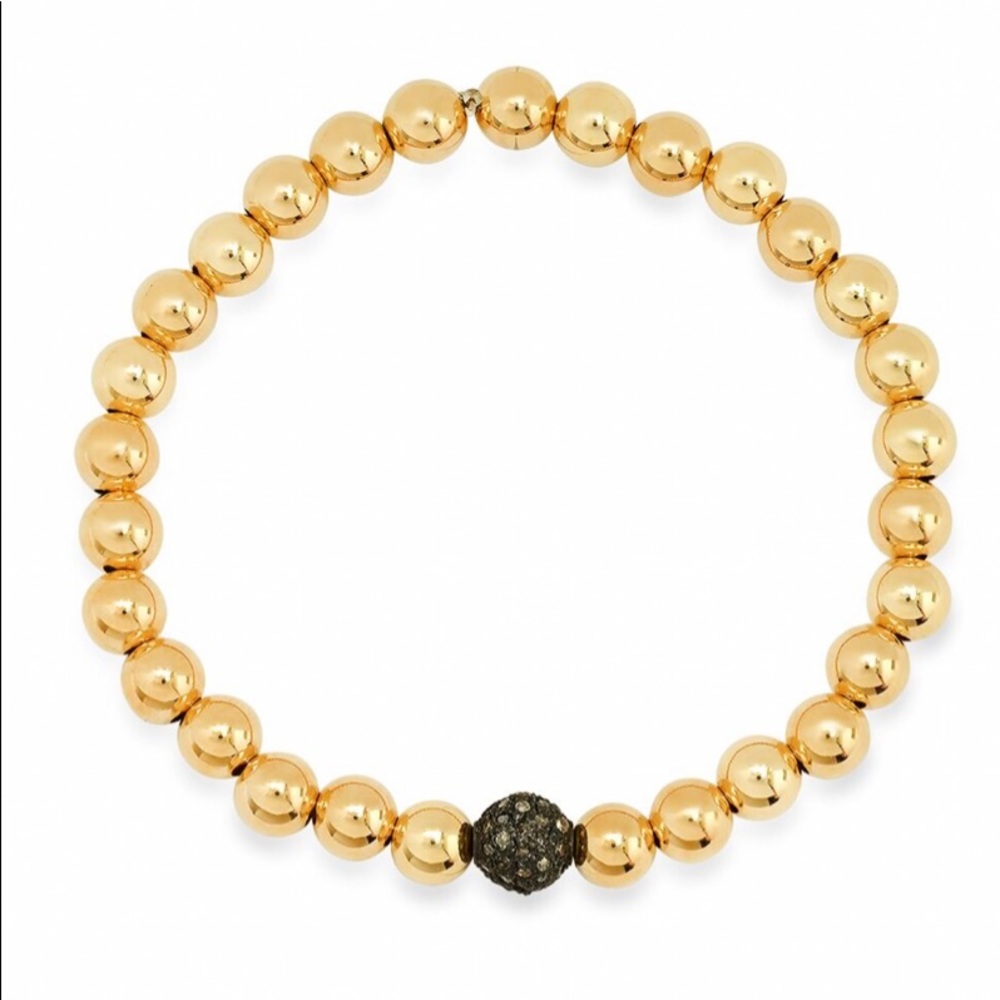 Gold beaded bracelet with pave diamond bead